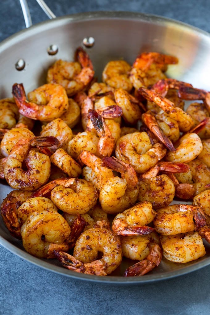 Seared shrimp in a skillet.