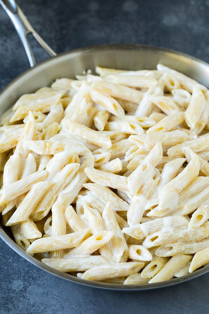 Penne pasta tossed in a creamy sauce.