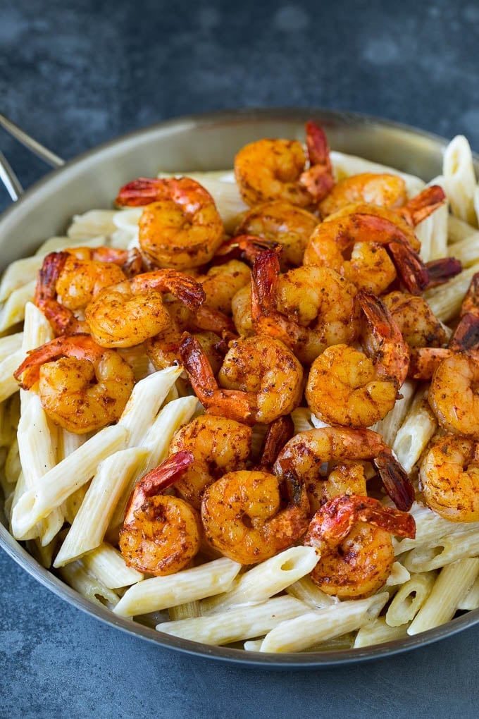 Cajun spiced shrimp over creamy pasta.