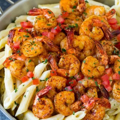 Cajun shrimp pasta with spiced shrimp, creamy sauce and tomatoes.