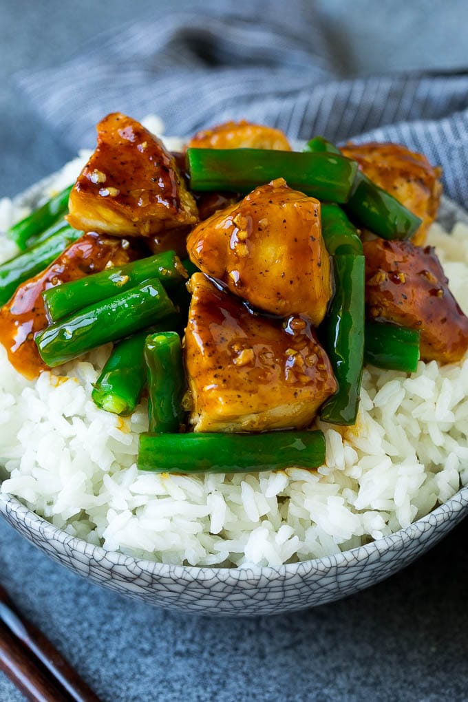 Chicken and green bean stir fry served over rice.