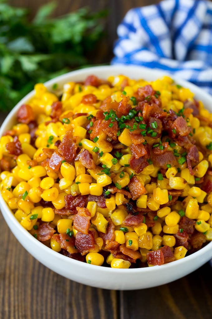 A serving bowl of Southern fried corn with bacon.