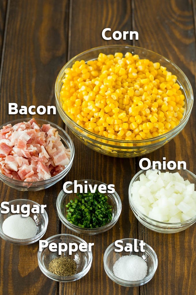 Bowls of corn, bacon, herbs, and seasonings.