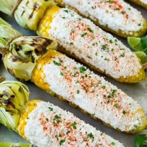 Mexican street corn with mayonnaise, crema, cotija cheese and chili powder.