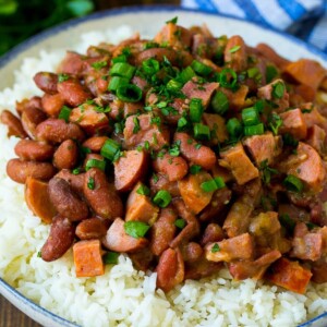 Red beans and rice with sausage, ham and vegetables, topped with herbs.