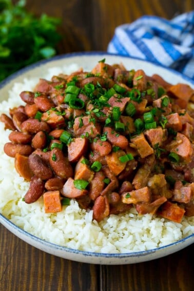 Red beans and rice with sausage, ham and vegetables, topped with herbs.