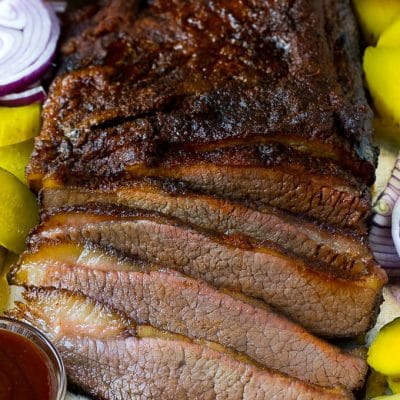 Smoked brisket sliced and served with pickles, onions and bread.