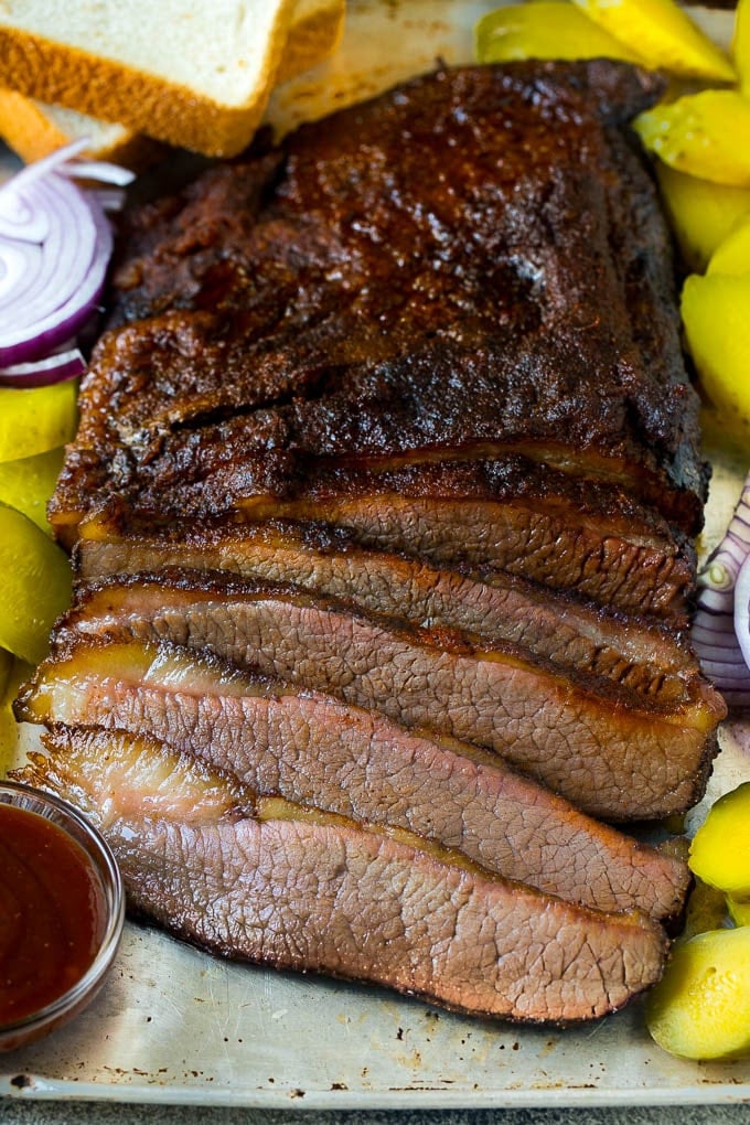 Smoked brisket sliced and served with pickles, onions and bread.