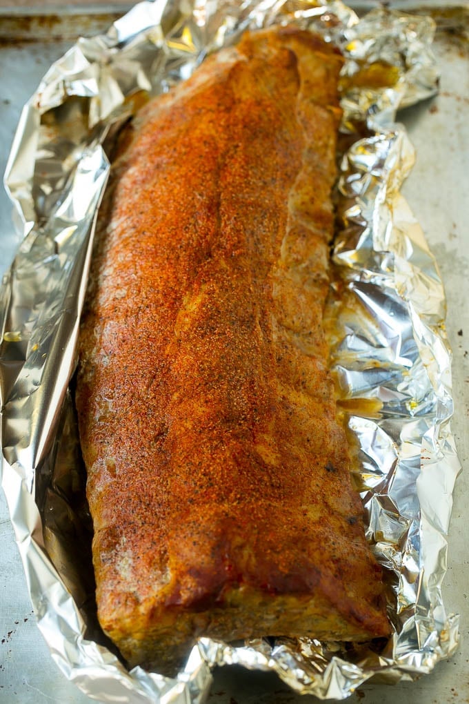 A rack of ribs inside aluminum foil.