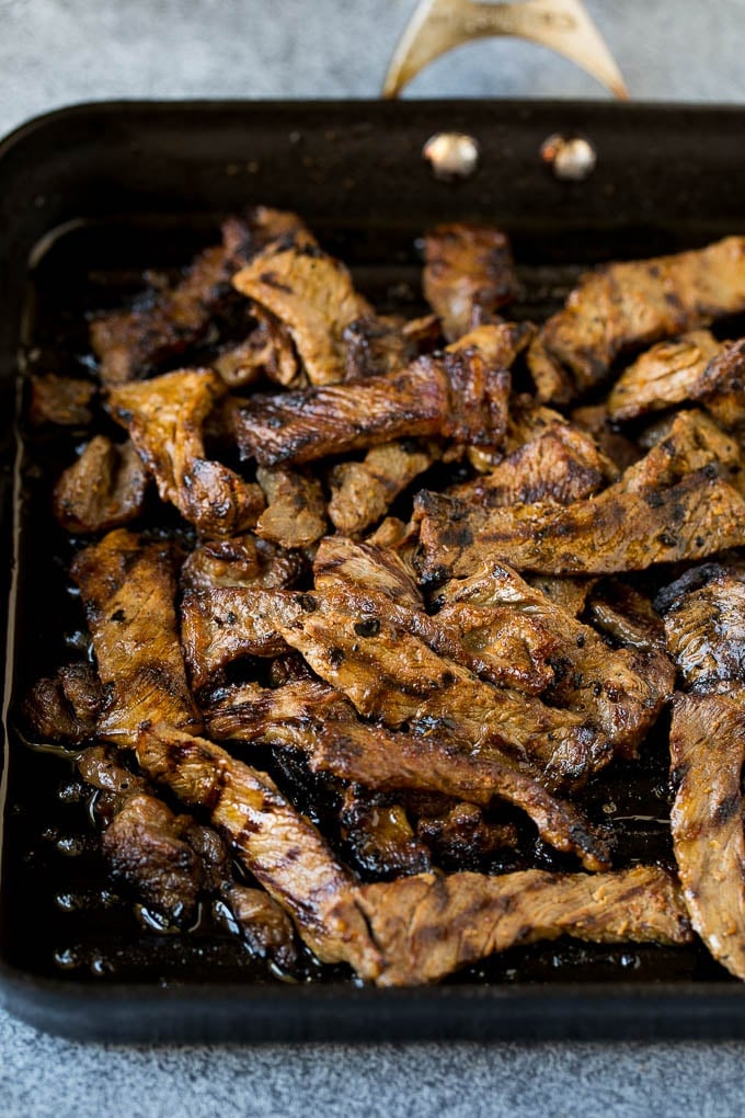 Beef strips cooked on a grill pan.