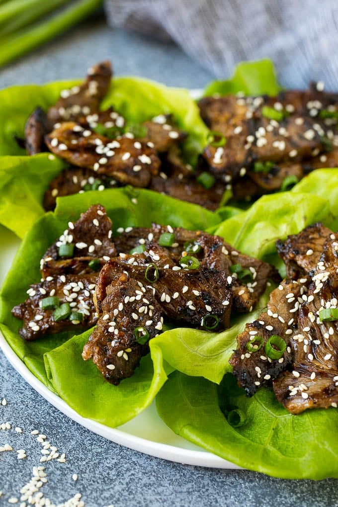 Lettuce cups filled with beef bulgogi and green onions.