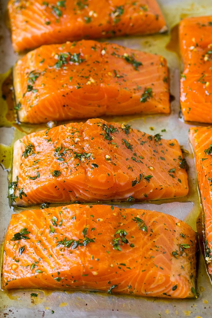 Salmon fillets on a sheet pan.