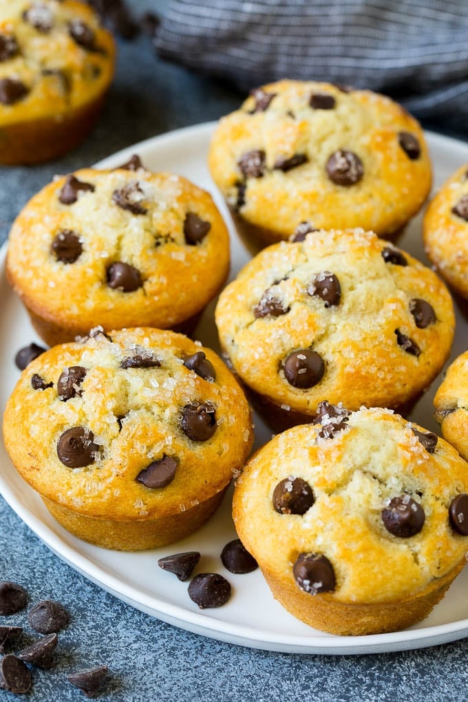 Chocolate chip muffins on a serving plate.
