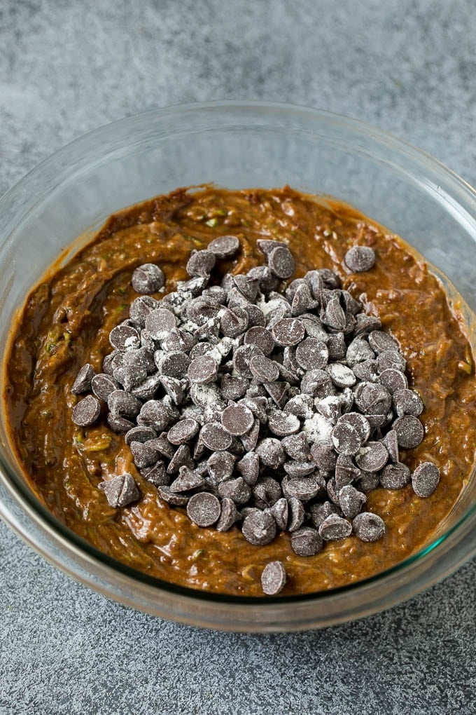 Chocolate batter in a mixing bowl with chocolate chips.