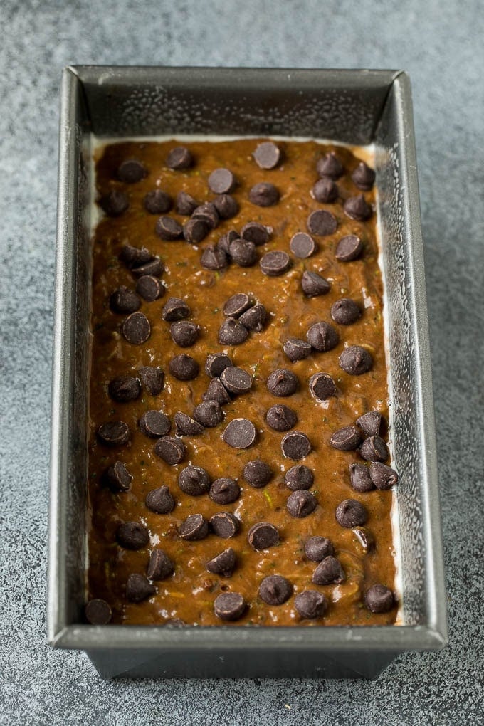 Zucchini bread batter poured into a loaf pan.