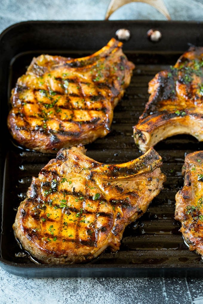 Pork chops on a grill pan.