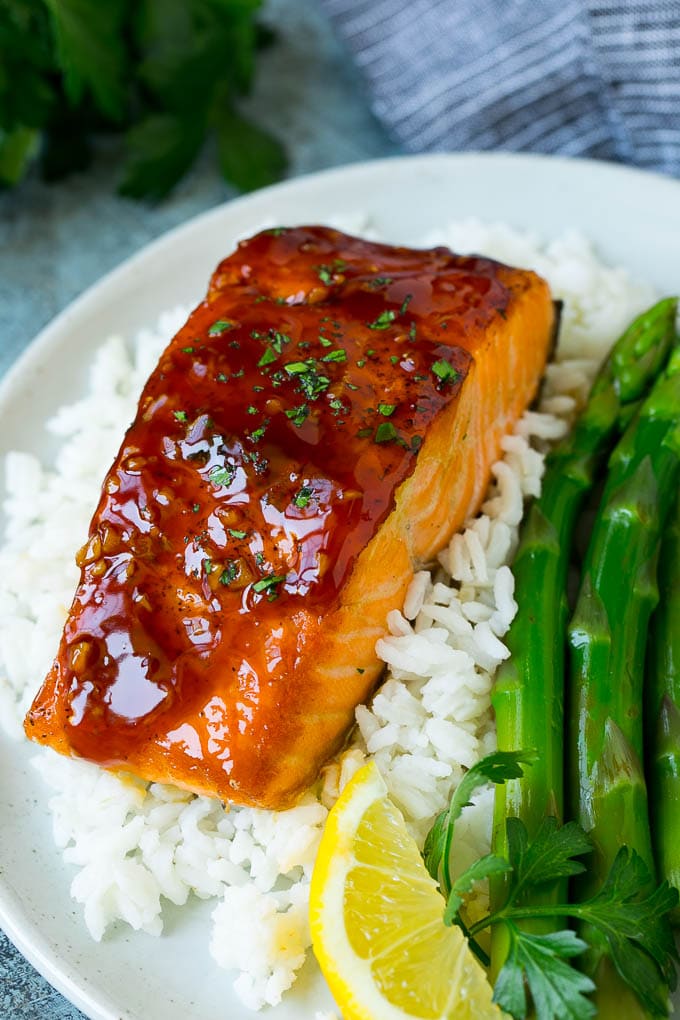 Honey glazed salmon served over rice with asparagus.