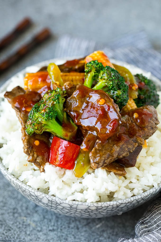 A bowl of Hunan beef stir fry over rice.