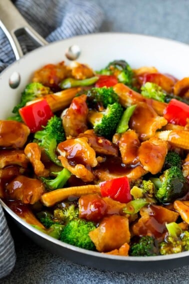 Hunan chicken with vegetables in a savory sauce.