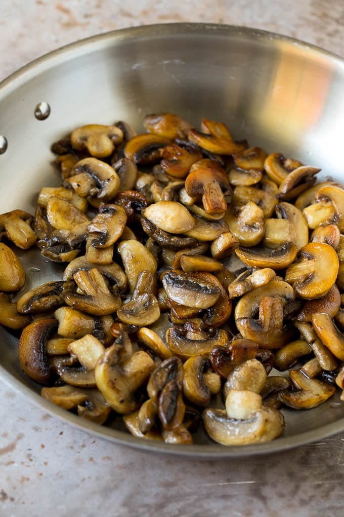 Sauteed mushrooms in a skillet.