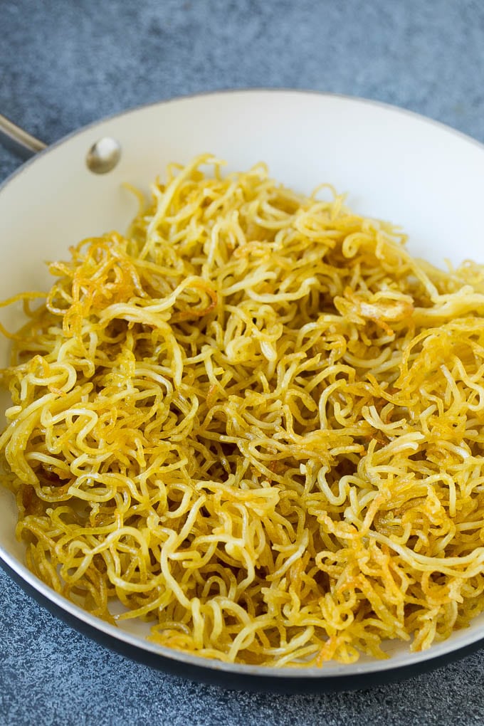 Crispy yakisoba noodles in a pan.