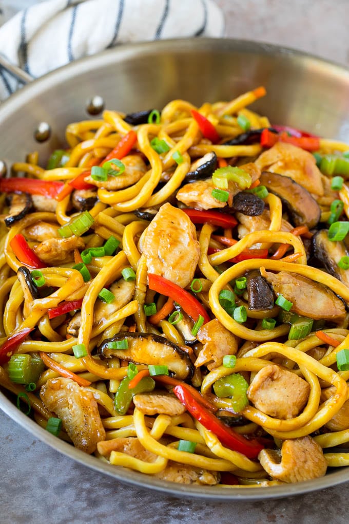 Stir fry noodles with chicken and vegetables in a savory sauce.