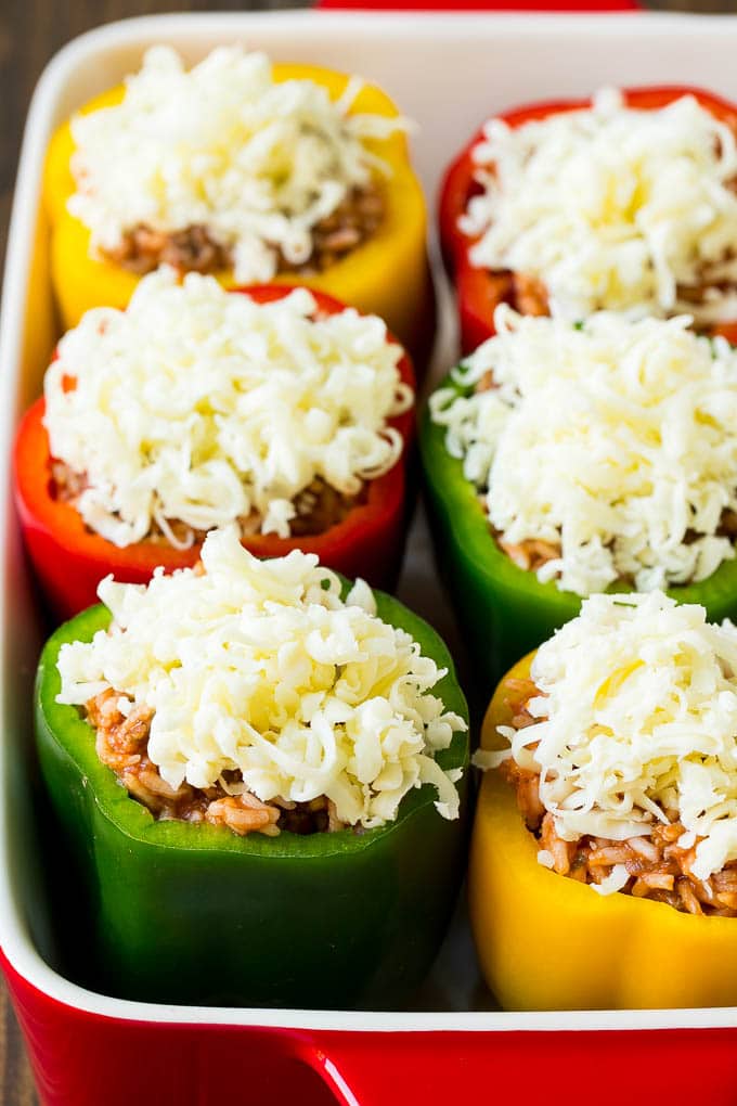Bell peppers filled with meat and rice, then topped with shredded cheese.