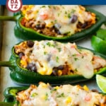 This recipe for stuffed poblano peppers is tender pasilla chiles filled with a mixture of ground beef, rice, black beans and vegetables, then topped with cheese and baked.