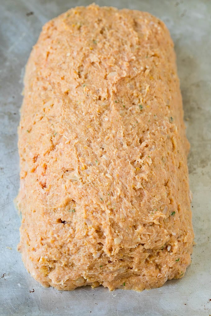 A ground turkey mixture shaped into a loaf.