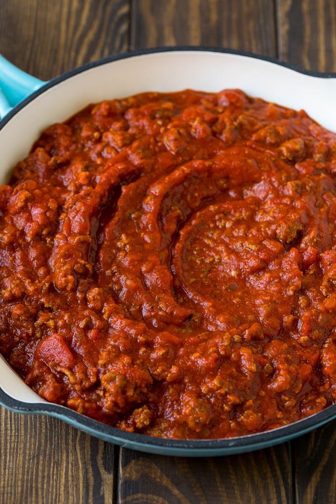 Meat sauce with ground beef and tomatoes in a skillet.