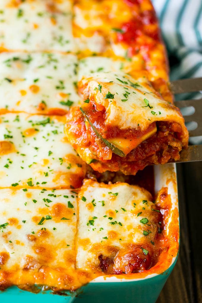 A spatula serving up a portion of zucchini lasagna.