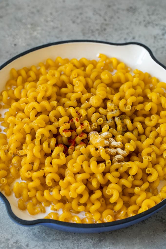 Dry pasta in milk with seasonings.