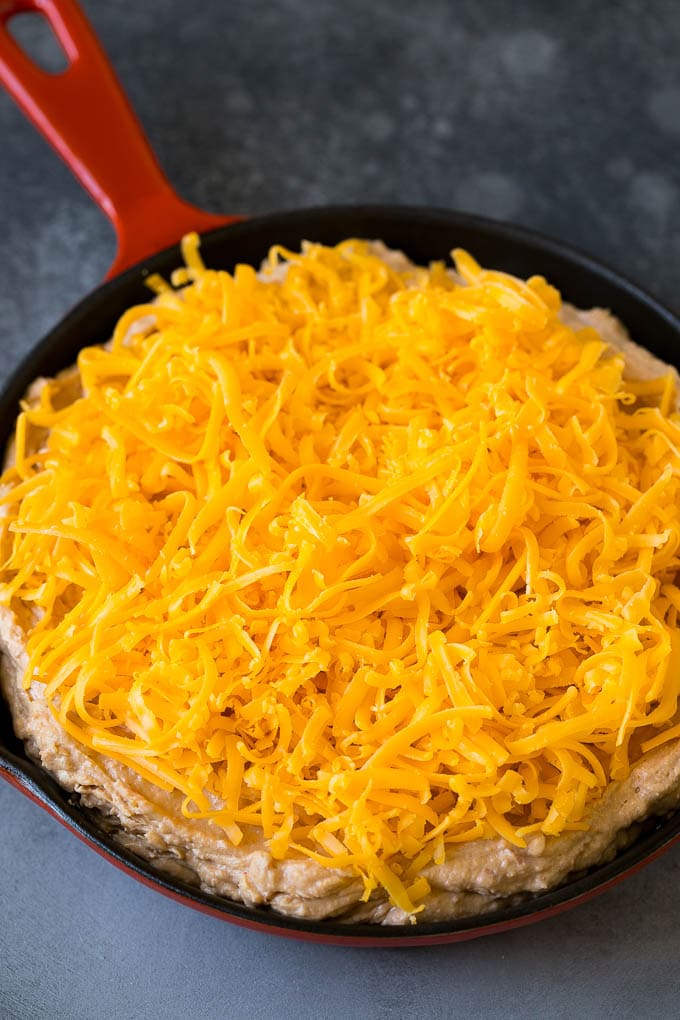 Creamy beans topped with shredded cheese.