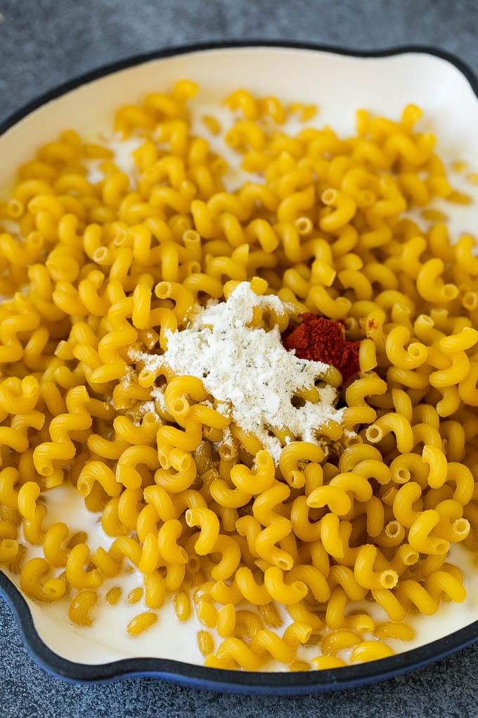 Uncooked pasta in milk with spices.