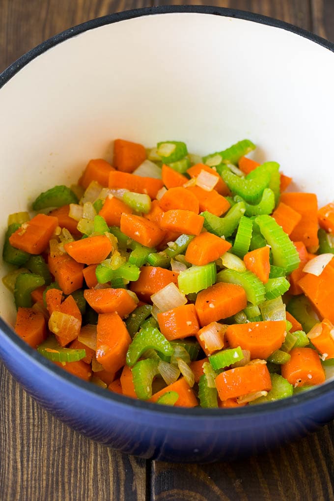 Onions, carrots, celery and garlic in a pot.