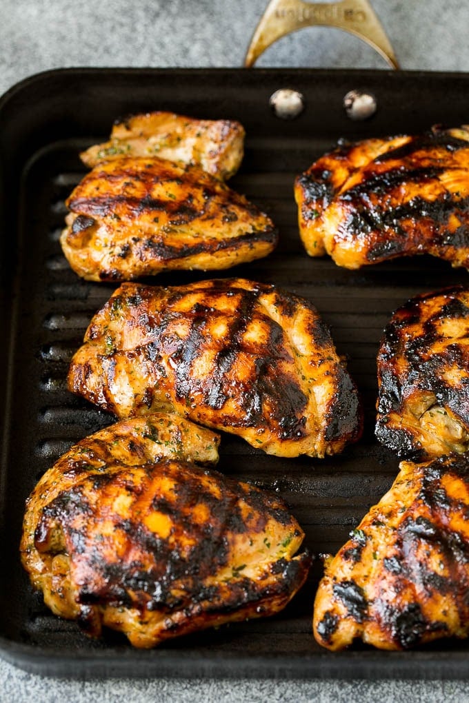 Chicken thighs cooked on a grill pan.