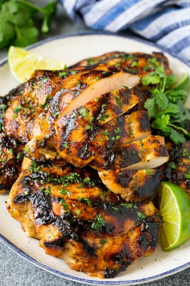 Sliced grilled chicken thighs with cilantro and lime flavoring.