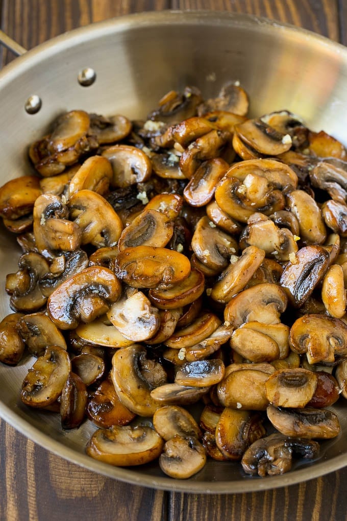 Sauteed mushrooms in a skillet.