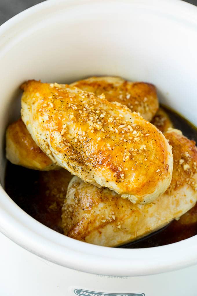 Chicken breasts with garlic and herb sauce poured over the top.