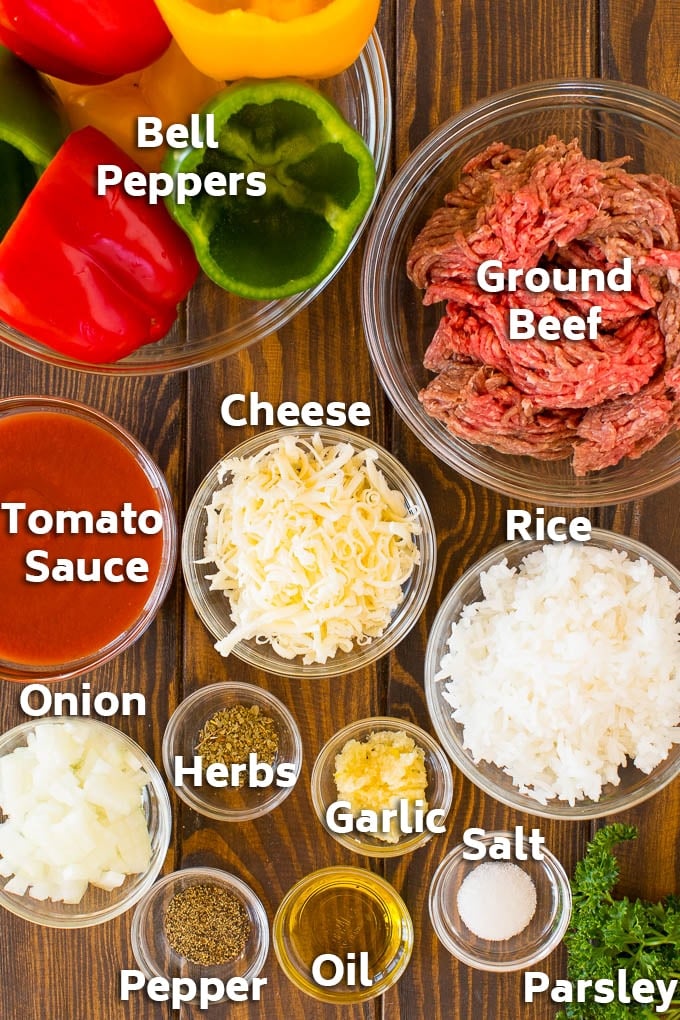 Bowls of ingredients including ground beef, peppers, rice and seasonings.