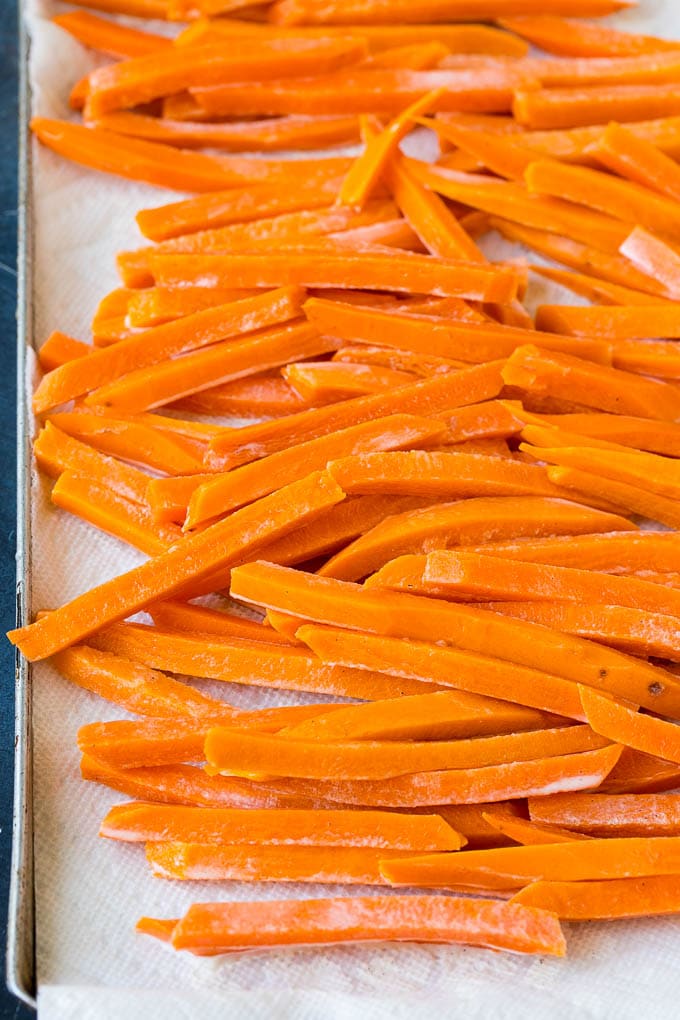 Pieces of sweet potato coated in a corn starch batter.