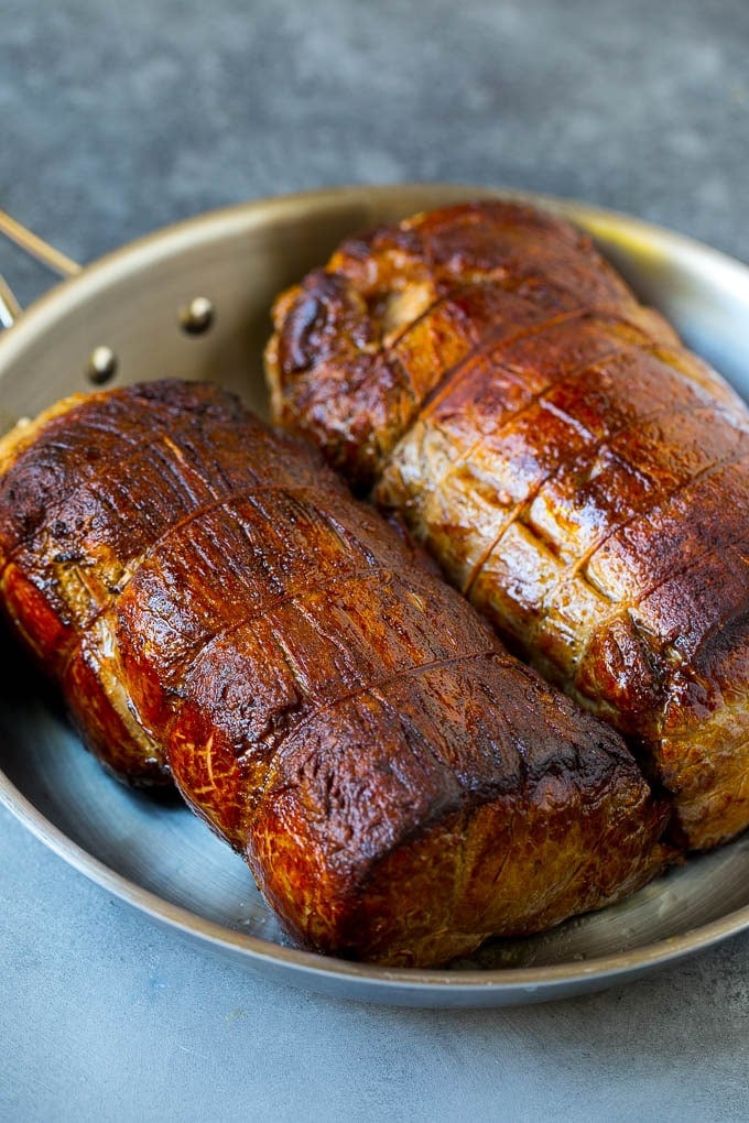 Beef Tenderloin with Garlic Butter #beef #steak #dinner #dinneratthezoo Seared tenderloin roasts in a pan.