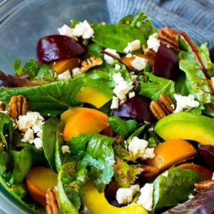 Beet salad with mixed greens, feta cheese and avocado.