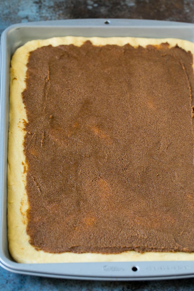 Brown sugar, butter and cinnamon spread onto dough.