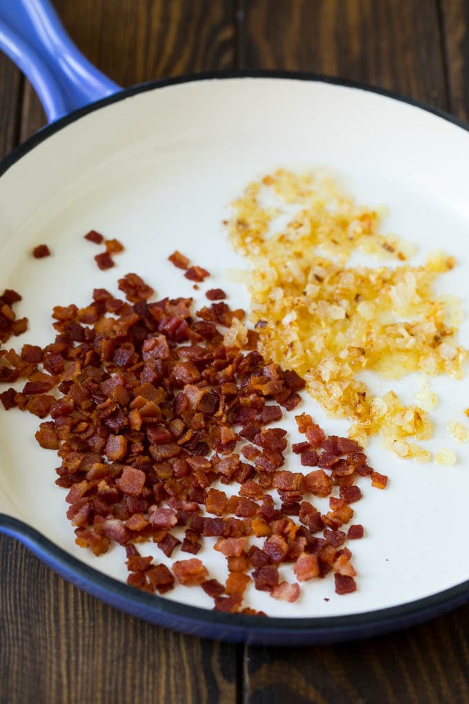 Bacon and onions in a skillet.