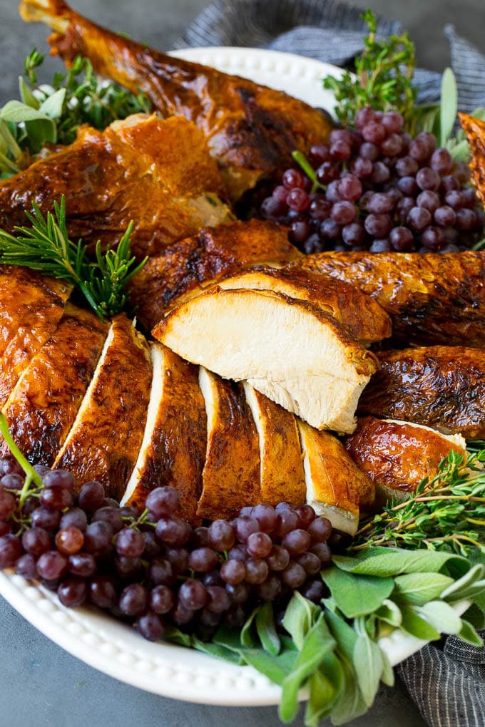 Sliced deep fried turkey on a serving platter.
