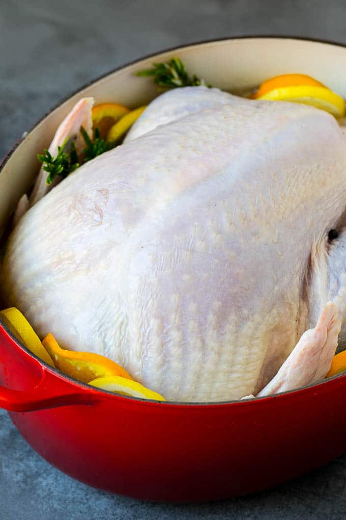 A raw turkey in a pot of brine.