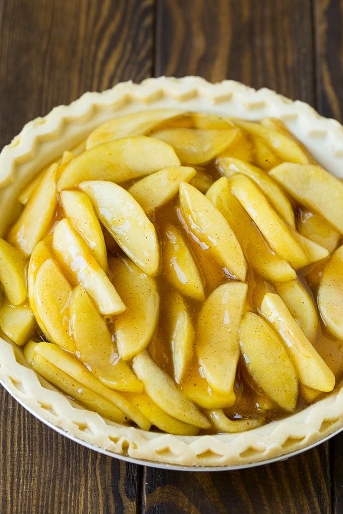 Apple filling inside of a pie crust.