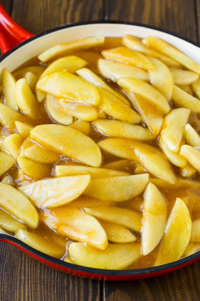 Homemade apple pie filling in a skillet.