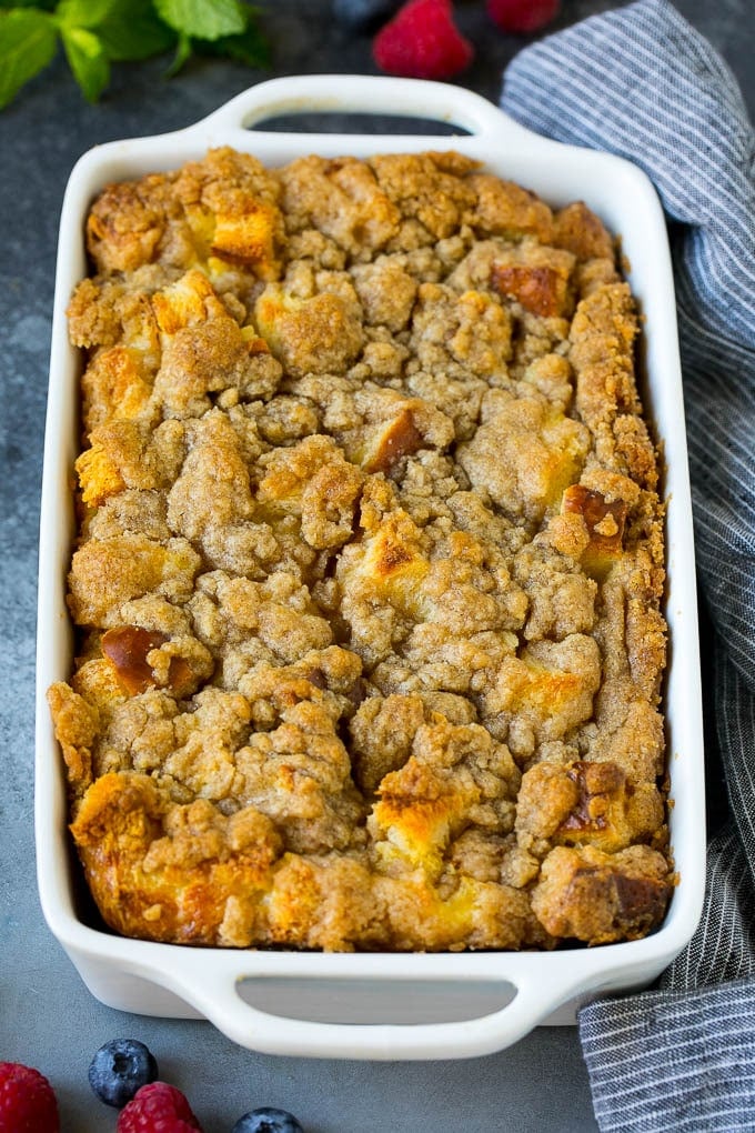 A dish of french toast casserole topped with brown sugar streusel.